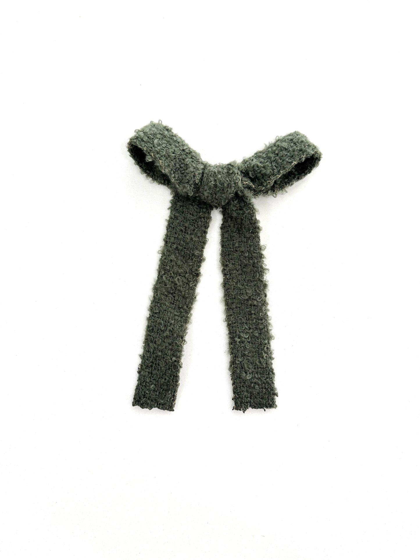 Soft, cozy green hair bow with plushy texture and flowy long-tail design