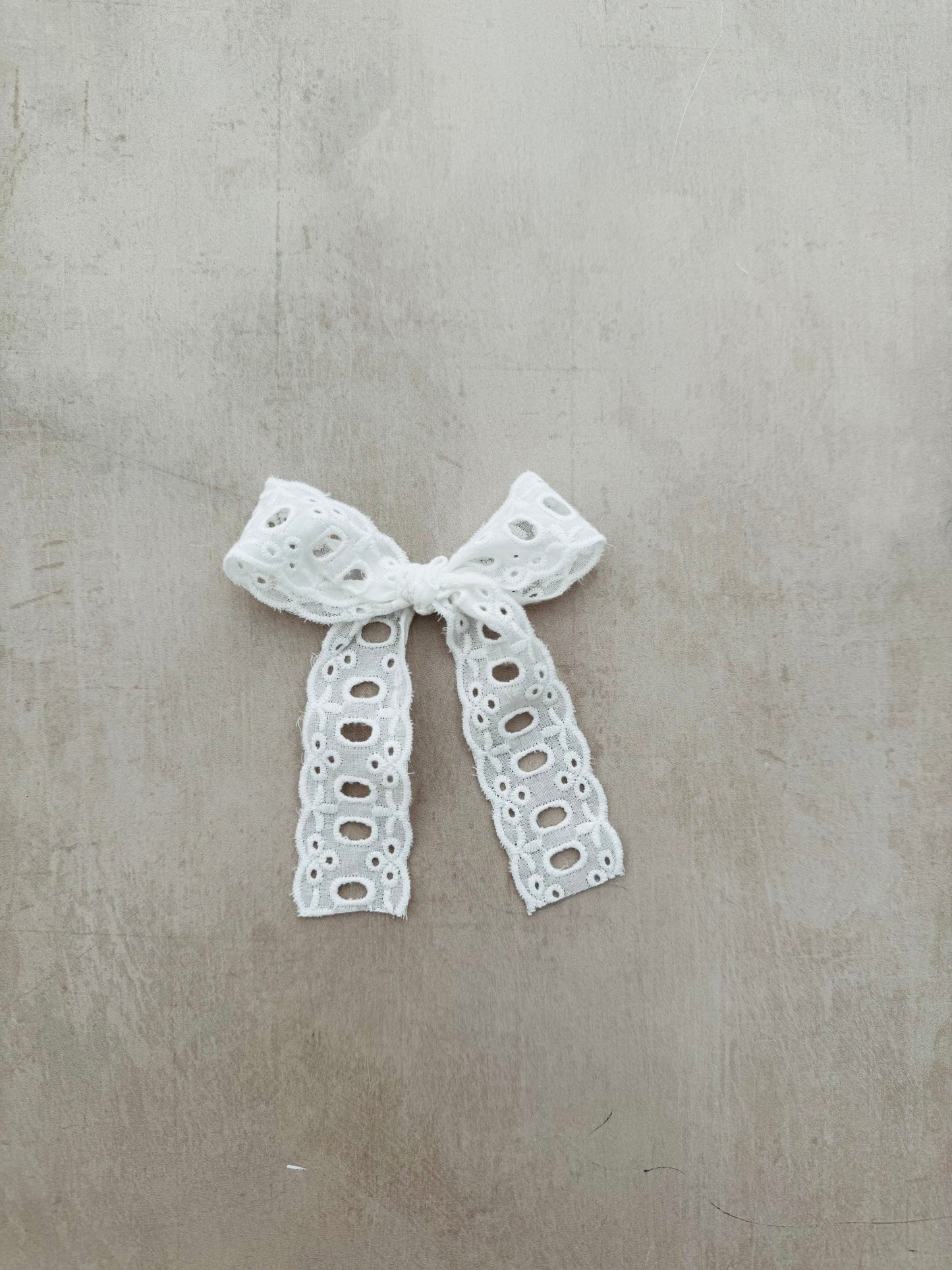 Eyelet ribbon bow