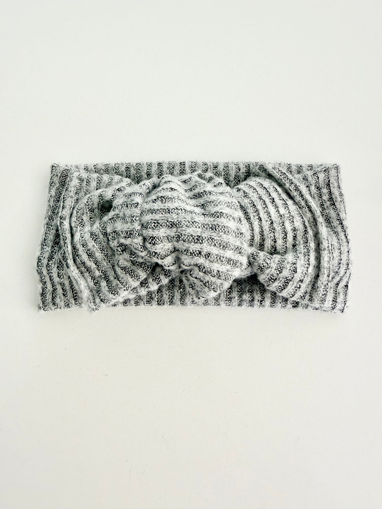 Grey jersey knit baby head wrap with subtle striped texture, stretchy fit