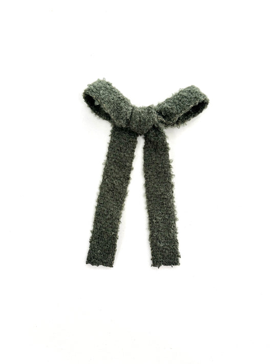 Soft, cozy green hair bow with plushy texture and flowy long-tail design