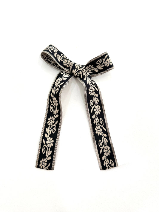 Heritage bloom long tail bow black and ivory flowers 