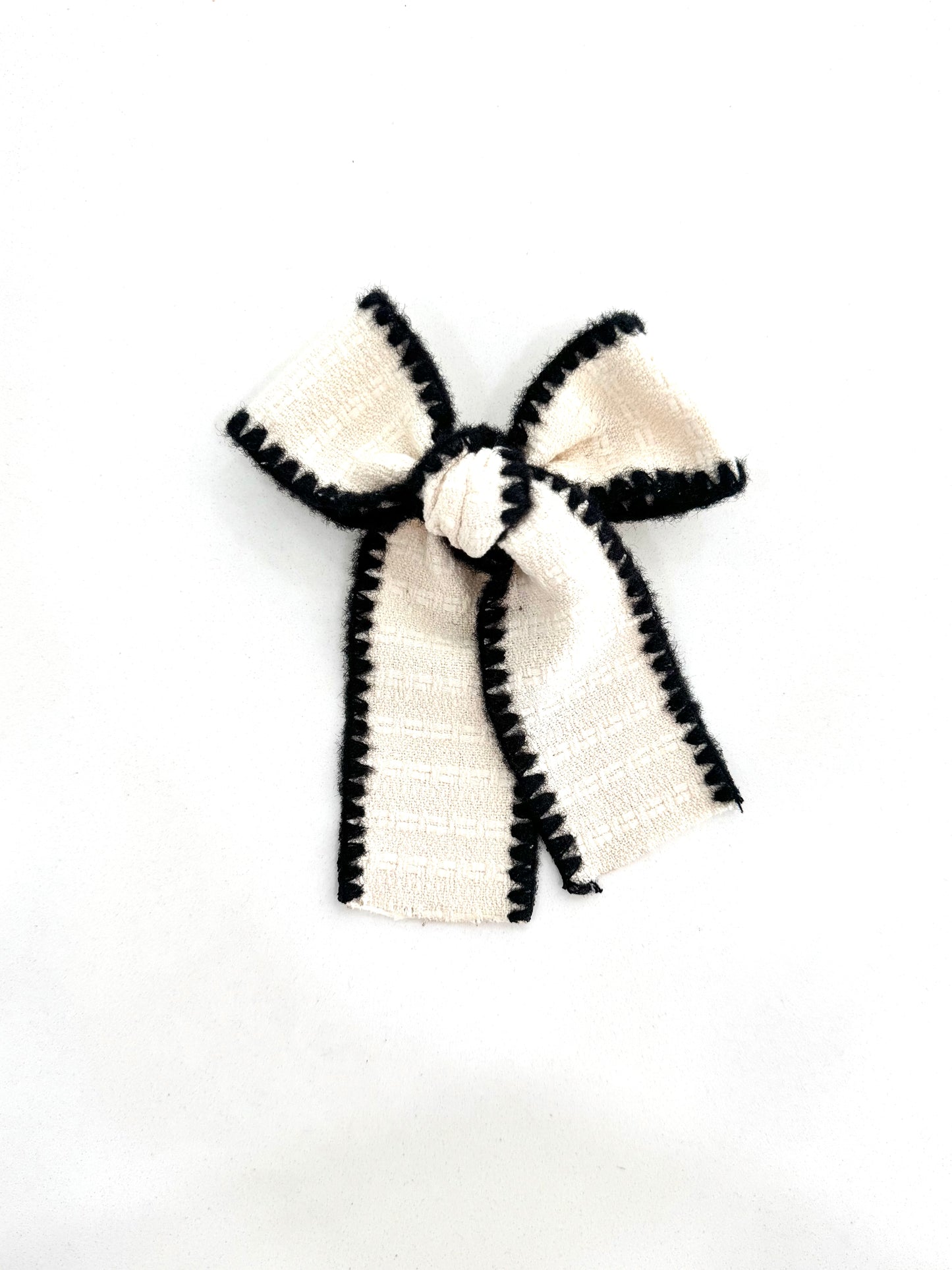 Willow Tail Bow in Ivory Noir – elegant long-tail handmade bow with rich texture and flowy tails
