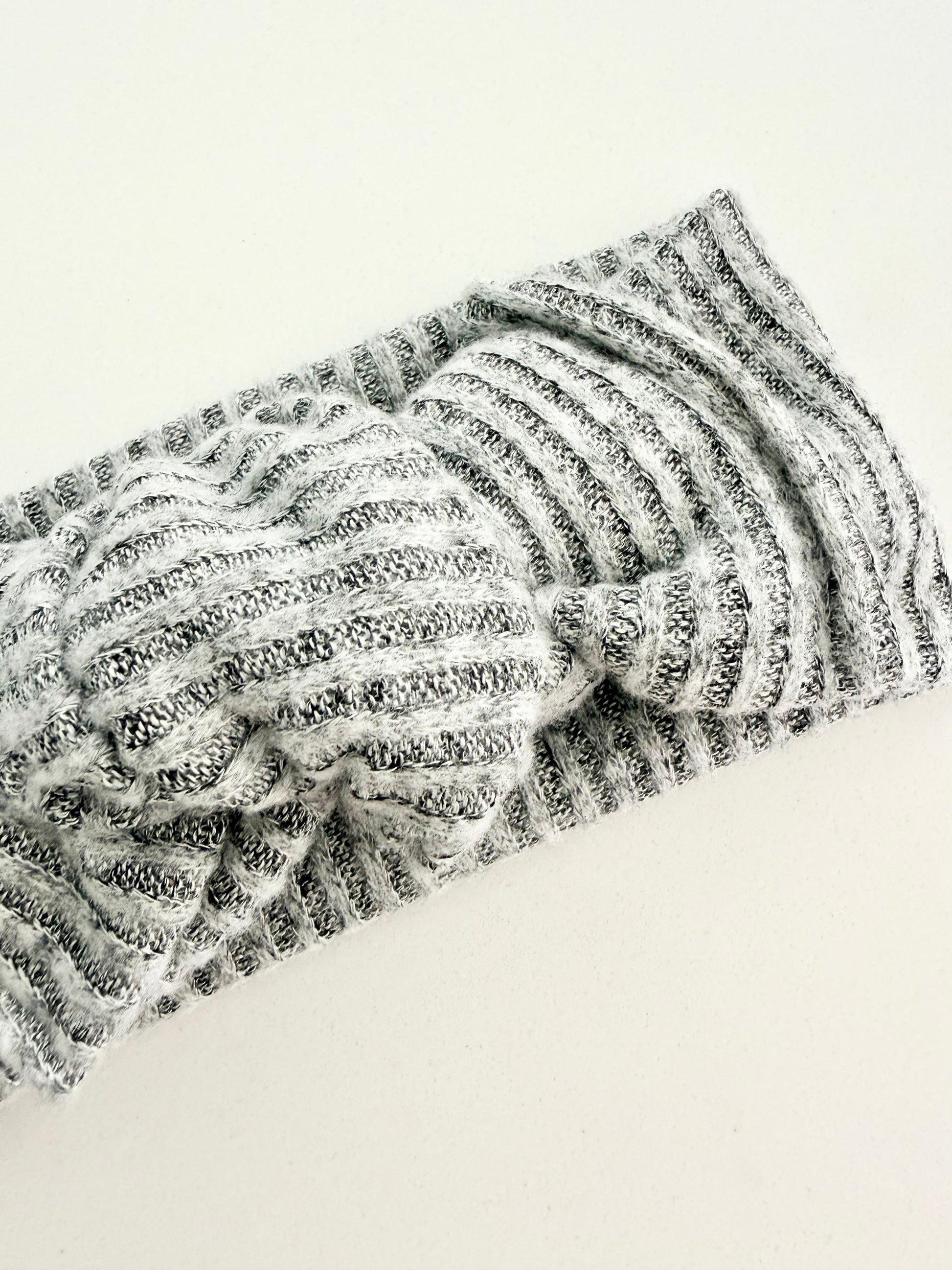 Grey jersey knit baby head wrap with subtle striped texture, stretchy fit