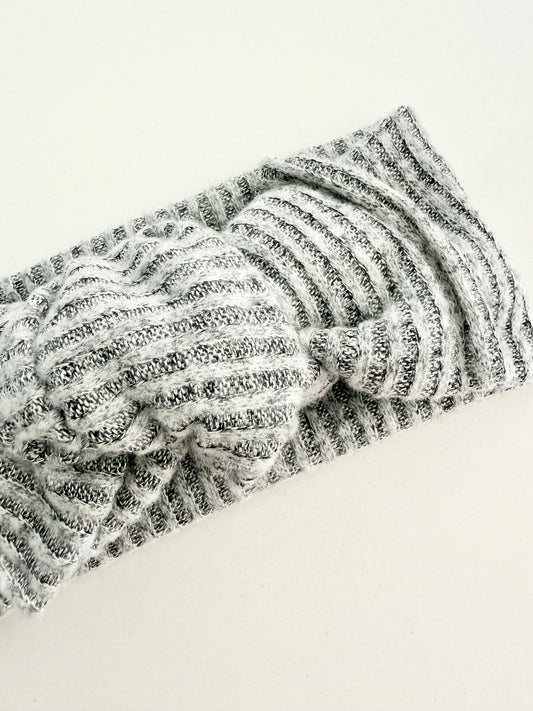 Grey jersey knit baby head wrap with subtle striped texture, stretchy fit