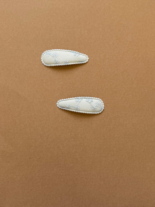 Sky blue  snap clip with scalloped edge and embroidered flower